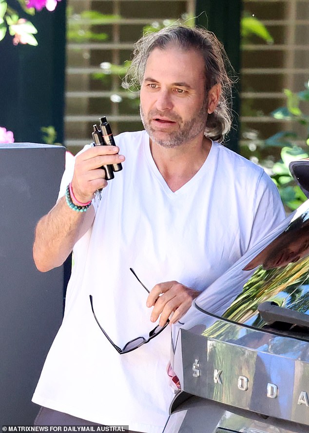 Bruce Lehrmann's housemate Mr Farrell is pictured outside the rental in North Sydney on Thursday.