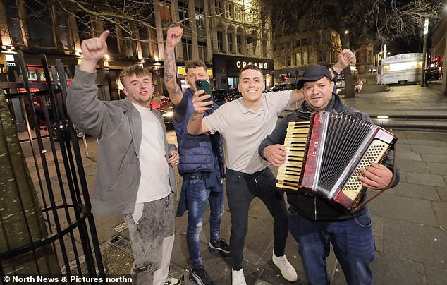 This group of guys stopped to dance with a man playing the accordion in Newcastle.