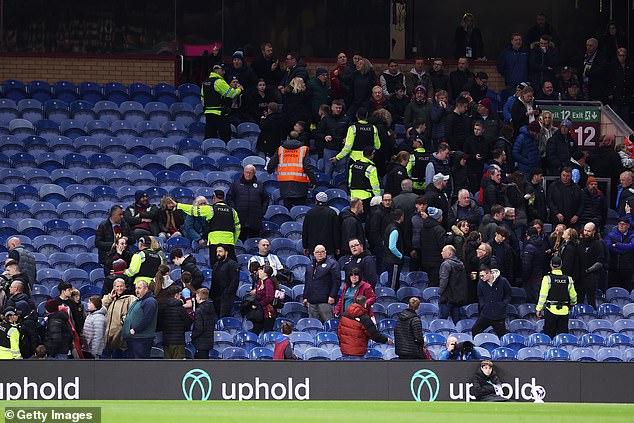 Police and stewards escorted fans out of an area of ​​the Jimmy McIlroy stand.
