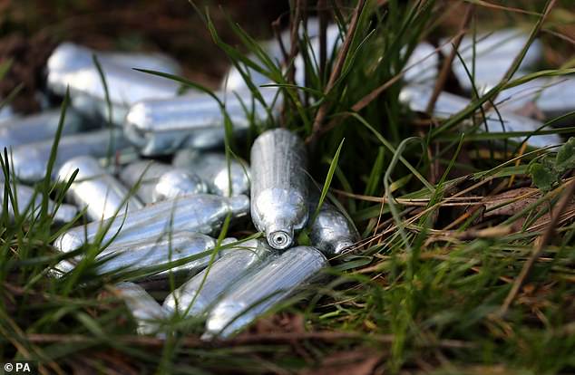 Discarded laughing gas canisters on the side of a road near Ebbsfleet, Kent
