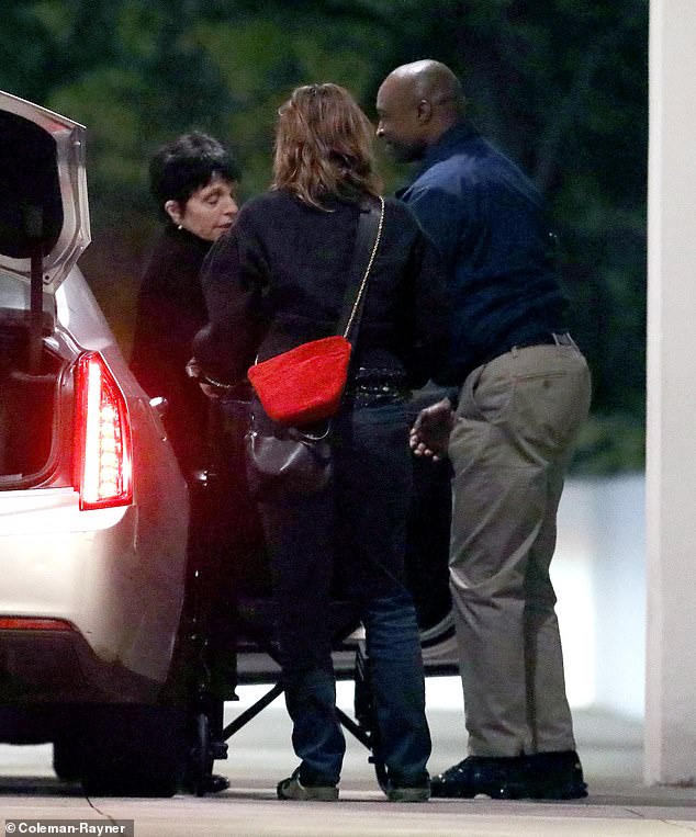 Liza Minnelli was seen being helped out of her car and into her wheelchair while returning to her Beverly Hills home on March 28.