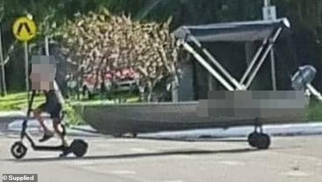 A Cairns resident was stunned to see a boy on an electric scooter towing a boat on Thursday.