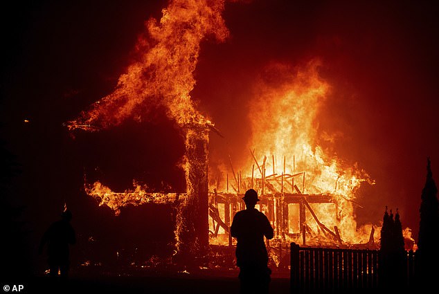 A growing number of insurers have limited or stopped operating altogether in California; many of them cite the increasing risk of climate disasters (pictured: wildfires in Paradise, California, in 2018).