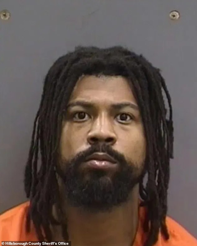Cam Sutton appears in a mugshot after turning himself in to police Sunday night.