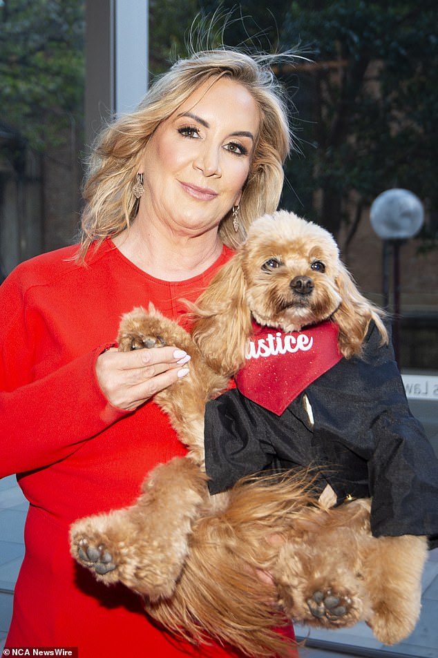 Channel Nine will pay $150,000 in damages to high-profile lawyer Gina Edwards (pictured with Oscar Cavoodle outside the Federal Court after winning her case on Friday)