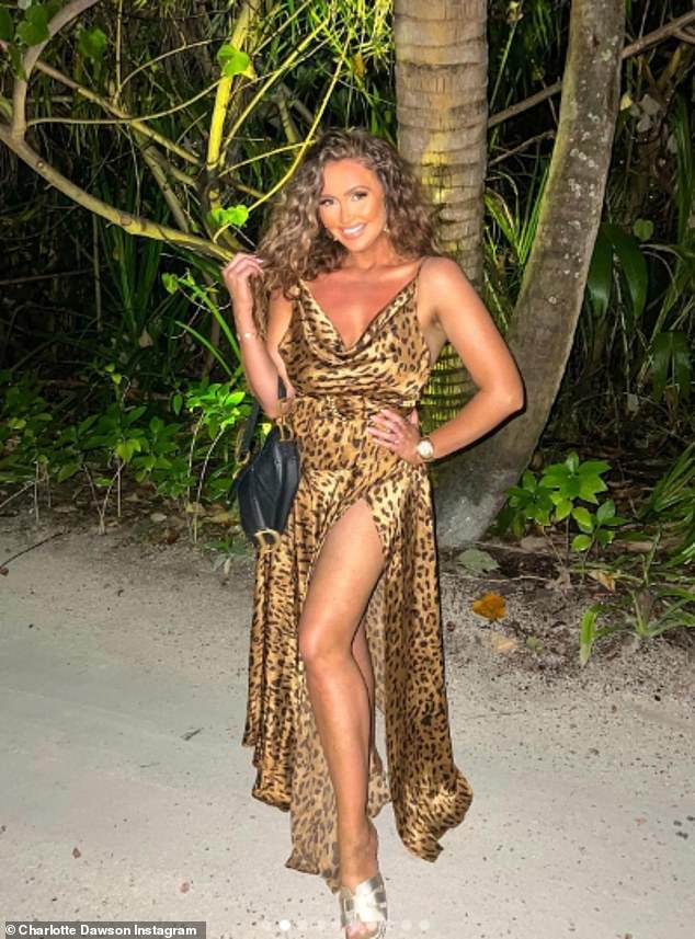 Charlotte Dawson put on a leggy display in a leopard print dress while on holiday in the Maldives.