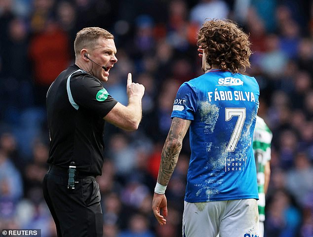 Fabio Silva initially received a yellow card from referee John Beaton (left) before the decision was overturned.