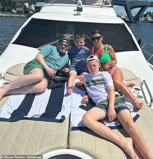Coleen Rooney looked incredible in a stunning bikini photo her husband Wayne shared to mark her 38th birthday on Wednesday (pictured with sons Kai and Klay).