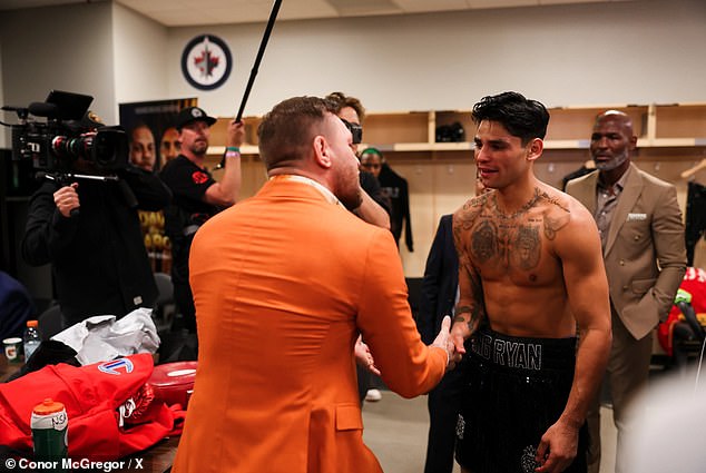The former UFC champion was seen shaking hands with Garcia backstage during the night.