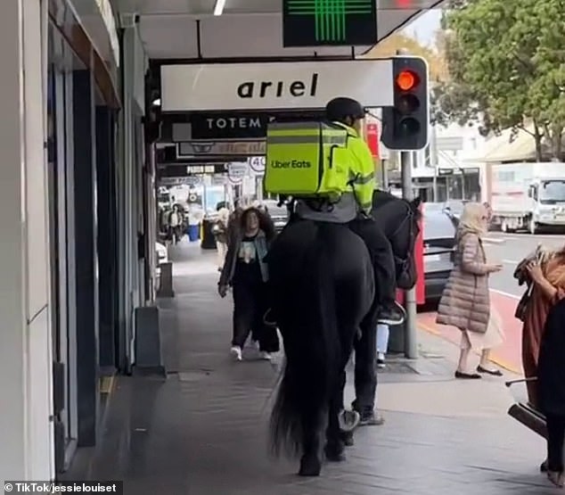 Mr Chen and Leilani strut around Paddington in Sydney;  Pedestrians stopped to take videos and seemed bewildered and delighted to see the horse galloping gently through the busy shopping area.