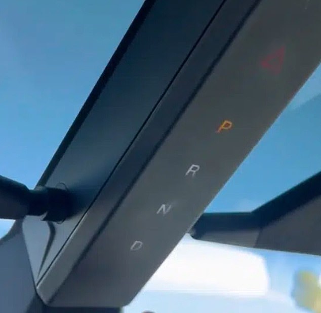 The unusual gear selector is located in a molding that runs down the center of the windshield. The sunshades are attached to the sides with magnets. A former Tesla engineer told DailyMail.com that this poor design puts too much pressure on the gear selector, which is not anchored firmly enough to handle it.