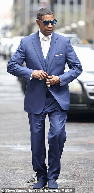 Denzel Washinton, 69, looked handsome in a blue three-piece suit for his scene on the streets of New York.