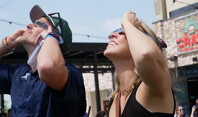 The solar eclipse was viewed by people across the country and Dello Russo said that fortunately, none of the people he has spoken to have suffered lasting damage to their eyes. This image shows a couple watching the eclipse from The Hub bar in Allen, Texas.