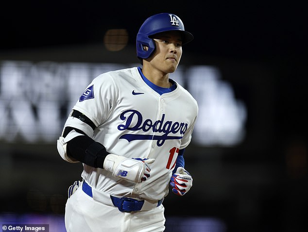 A lifelong Los Angeles Dodgers fan who caught Shohei Ohtani's first home run for the team claims she was pressured into returning the $100,000 item.