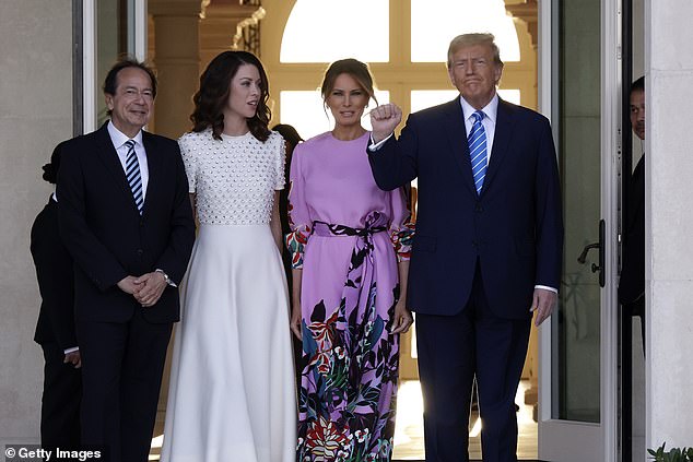 Donald Trump and his wife Melania are pictured with supporter John Paulson and his wife Jenny at a fundraiser in Palm Beach on Saturday that raised $50.5 million for his reelection campaign, an all-time record for a single fundraiser. Of funds.