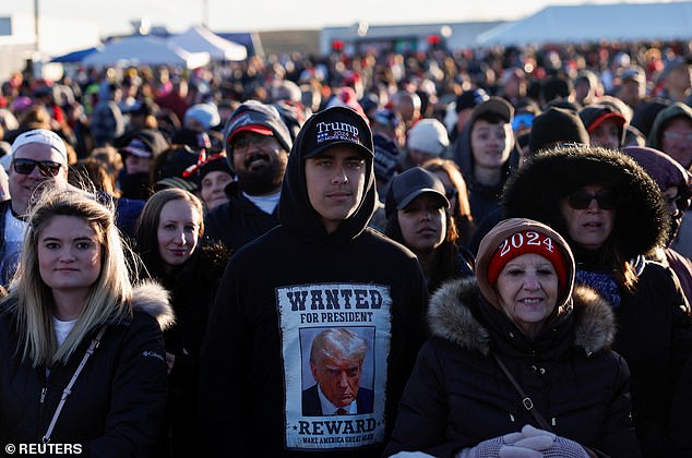 A Trump supporter wearing a hoodie with the former president's mugshot at his rally in Schnecksville, Pennsylvania, on Saturday.