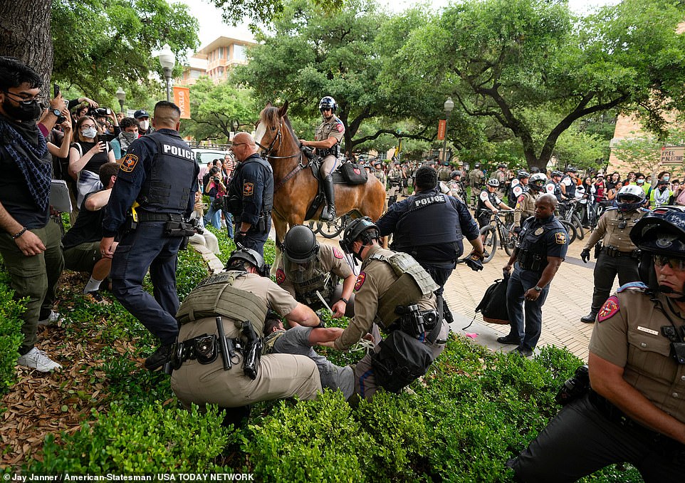 Police arrested at least four protesters at UT Austin after warning them they could face criminal charges if they did not disperse.