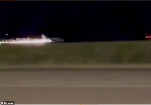 Sparks were seen flying from the Beechcraft 58 Baron as it landed at Gold Coast Airport around 9pm on Tuesday night (pictured).