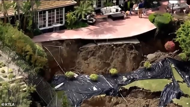 Several homes in California's Newport Beach were given yellow tags by officials after a landslide hit the cliff behind the properties.