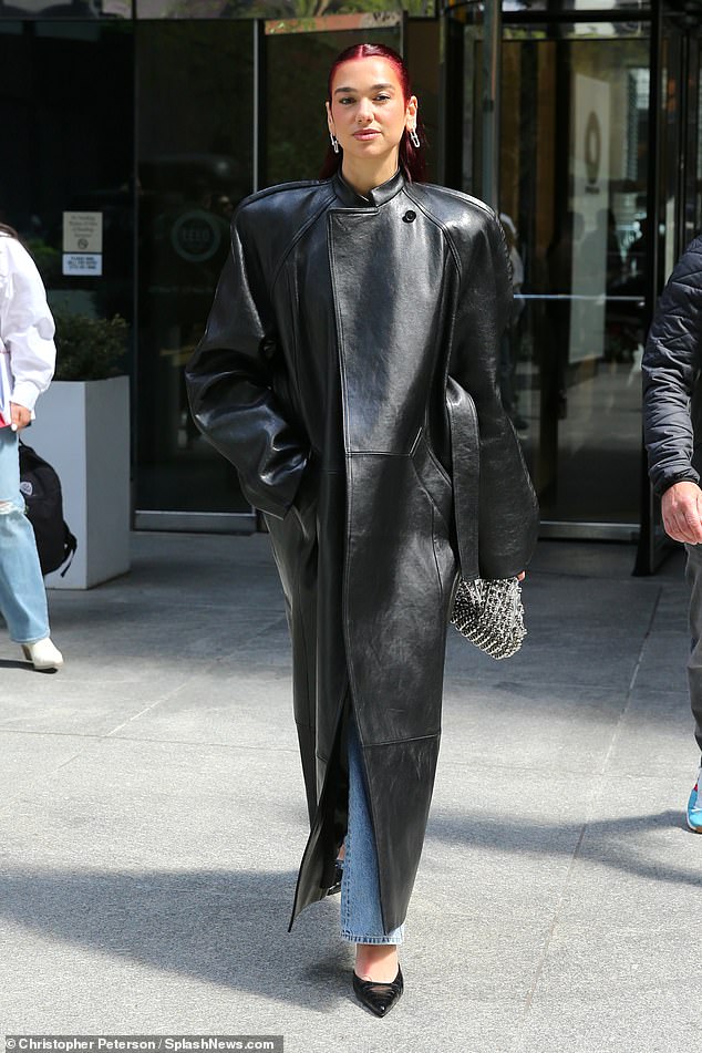 Dua Lipa showed off her fashion-forward style in New York on Wednesday in a statement leather coat.