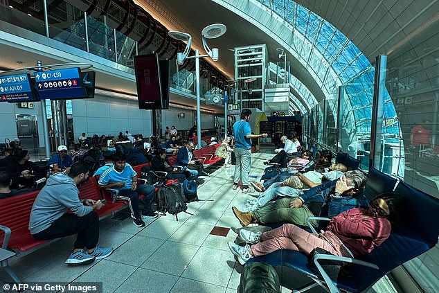 Passengers wait for their flights at Dubai International Airport as several flights have resumed.