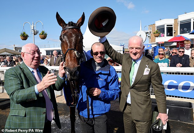 Willie Mullins (R) will be crowned champion trainer at the final Sandown show jumping meeting