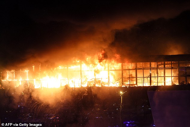 A view shows the Crocus City Hall concert venue in flames following an ISIS attack on March 22.