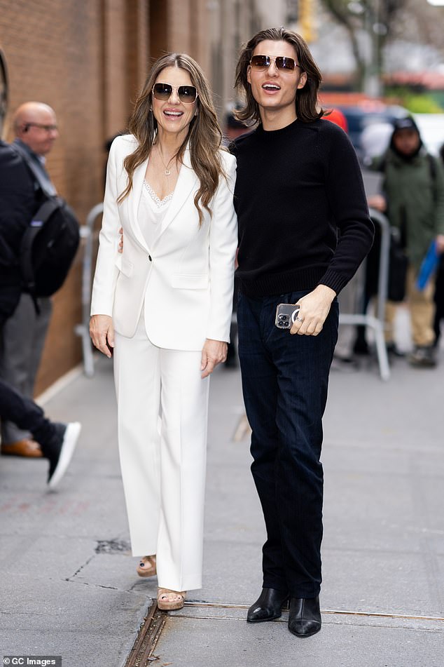 Elizabeth Hurley has laughed off persistent speculation that she is the older woman responsible for claiming the virginity of teenage Prince Harry (pictured with her son Damian).