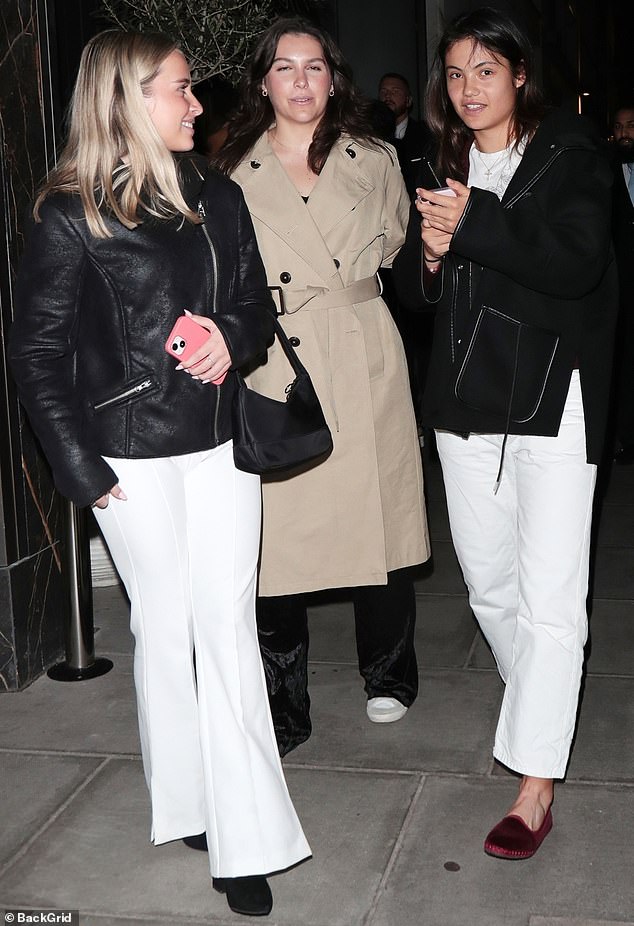 Tennis ace Emma Raducanu (pictured, right) is seen leaving Gaia in Mayfair with friends on a night out in London