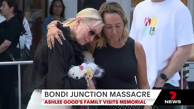 Her mother, wearing dark glasses and holding stuffed toys, was comforted by prominent defamation lawyer Rebekah Giles, who was a close friend of Ashlee and had been with her moments before the stabbing (pictured).