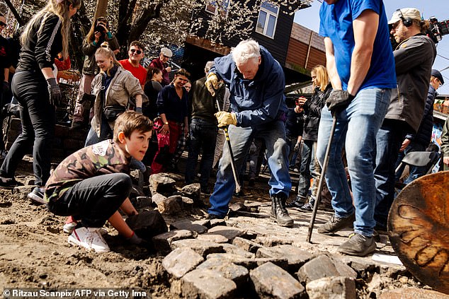 Young children and elderly people were among those who broke the cobblestones of Pusher Street.
