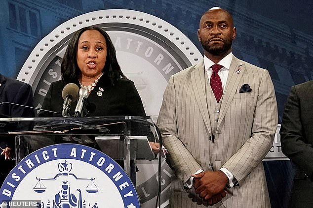 Willis speaks at a news conference alongside prosecutor Nathan Wade after a grand jury returned indictments against former President Donald Trump.