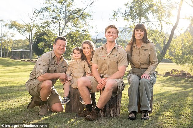 Irwin family fans were left concerned about why a 'family member' disappeared from their social media.  Pictured left to right: Chandler Powell, Grace Warrior Irwin Powell, Bindi Irwin, Robert Irwin, Terri Irwin