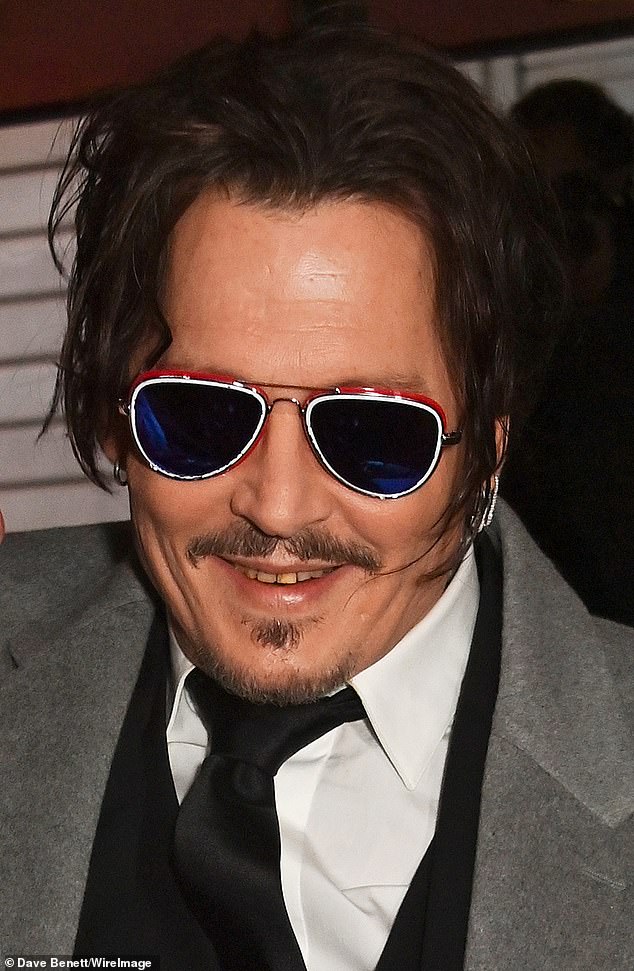 Johnny Depp showed off his yellowed teeth at the British premiere of his period drama Jeanne Du Barry in London on Monday.