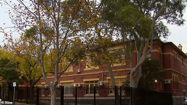 A woman has been charged with allegedly kidnapping a boy from Fitzroy Primary School in Melbourne (pictured) in a terrifying incident on Friday morning.