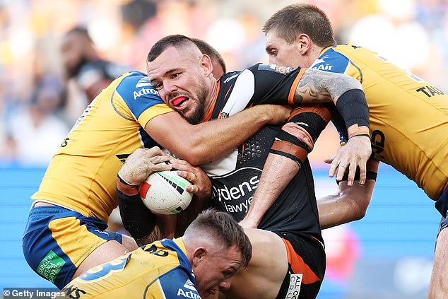 Wests Tigers prop Dave Klemmer (centre, carrying the ball) has been sensationally accused of cheating to ensure his team beat Parramatta in an Easter Monday NRL thriller.