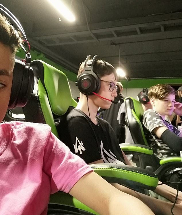 Ashman, at 15, was the youngest esports player to win a million dollars.  He is pictured alongside his teammate at the Fortnite World Cup Final in 2019.
