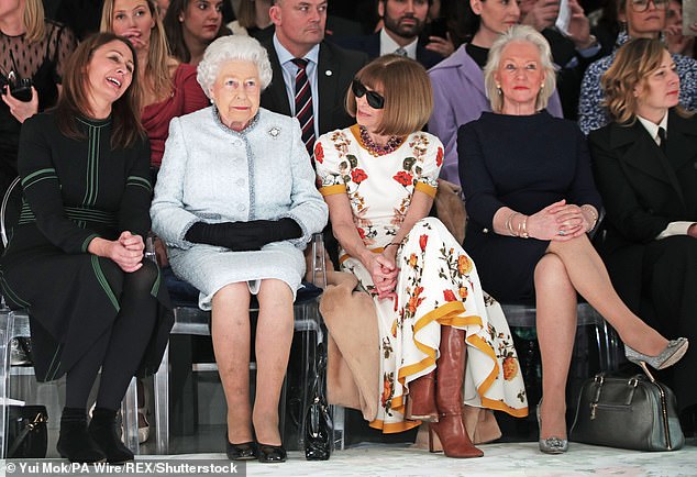 Queen Elizabeth sits front row at a runway show with Anna Wintour (third right), Caroline Rush, chief executive of the British Fashion Council (left) and royal couturier Kelly (second right) in 2018.