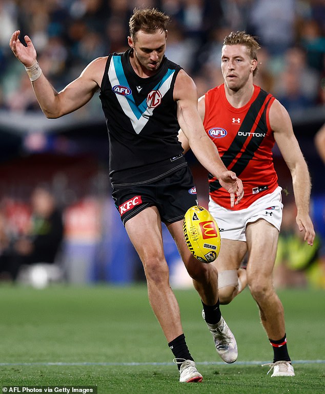 Two openly gay footballers have called on the AFL to suspend Port's Jeremy Finlayson (pictured left) following the homophobic slur he uttered during the Gather Round.