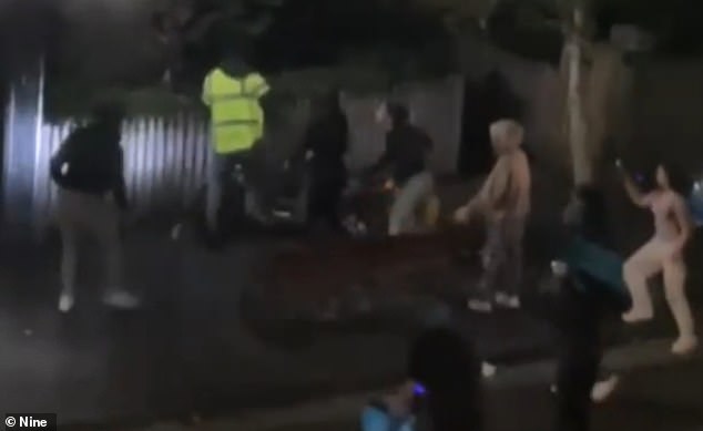 A gang of young thugs have been caught on film allegedly attacking a delivery driver out of nowhere in an incident that has locals fearing an escalation of violence (pictured)