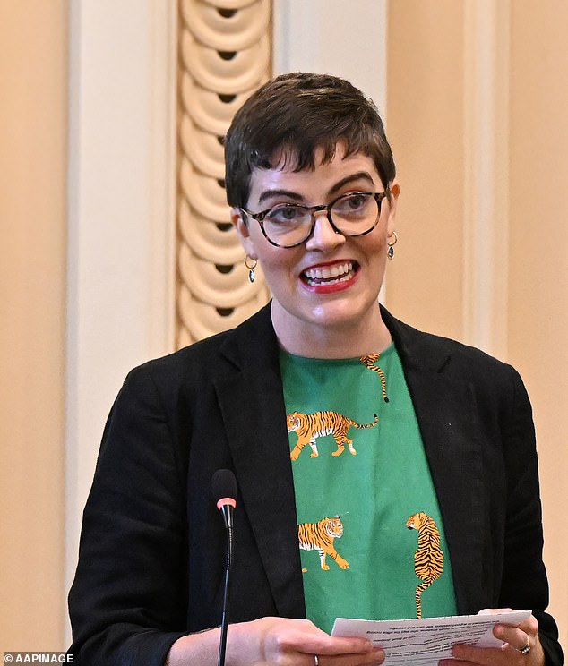 Queensland Greens MP Amy MacMahon (pictured) has made an emotional return to state parliament, two months after being seriously injured in a car crash.