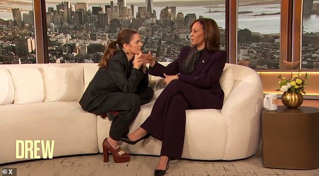 Harris joined actress Drew Barrymore on her daytime talk show, where the two sat unusually close together on the large couch.  In a moment of embarrassment, Barrymore called an unamused Kamala Harris 'Momala'.