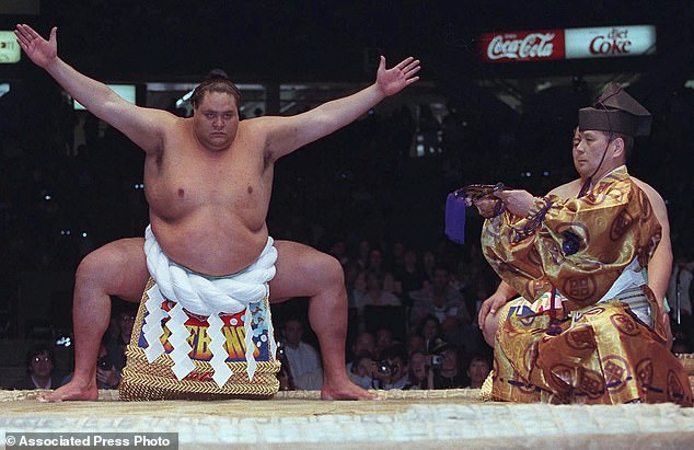 Hawaiian-born Taro Akebono, Japan's top sumo wrestler, participates in a ring ceremony before competition in Vancouver, British Columbia, June 6, 1998.