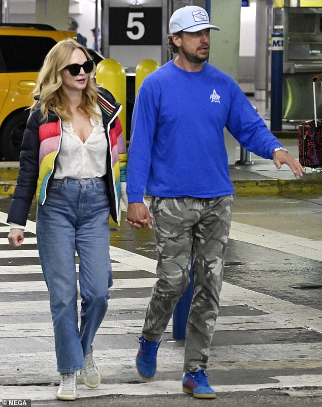 Heather Graham landed at Miami International Airport with her boyfriend John de Neufville on Monday after living life in Mexico.