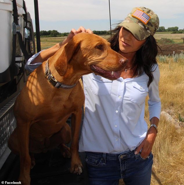 South Dakota Governor Kristi Noem is photographed with another dog she owned, Hazel, a Vizsla.