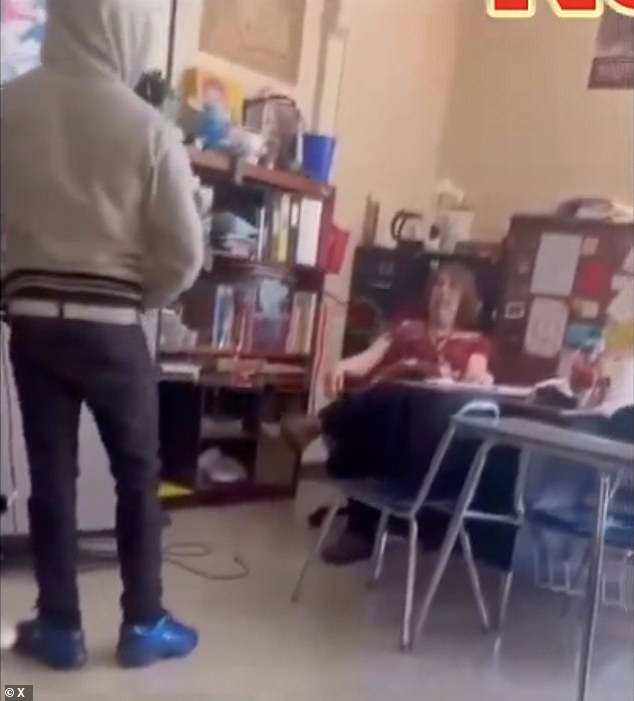 Phones are slammed at Parkland High School in North Carolina as the student attacks his teacher in class, towering over her and delivering a series of punches.