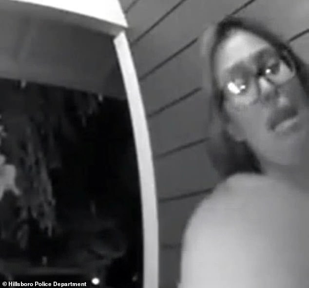 The woman is seen running to a stranger's house and ringing the doorbell on Sunday.