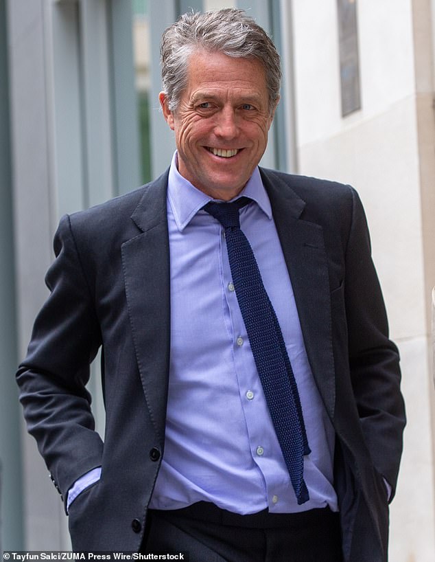 Hugh Grant is pictured outside the High Court in London on April 27 last year.