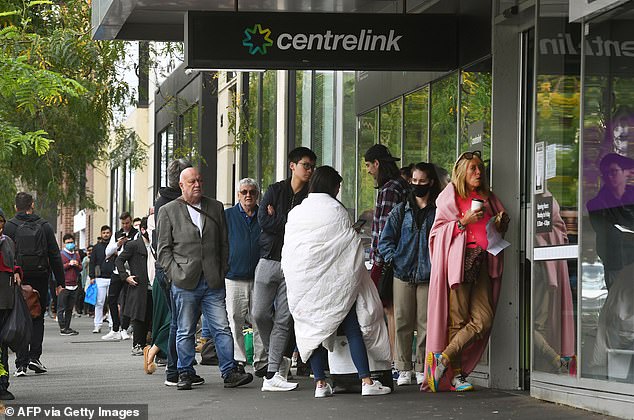 A woman whose mother died of cancer a year ago has slammed Centrelink for sending her a letter asking her to pay a debt she says her mother owed.  Pictured are people queuing outside a Centrelink office in Melbourne.