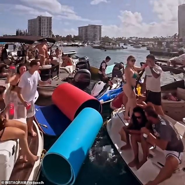 Revelers are seen packed into boats in the middle of the lake while drinking alcohol and partying all day.
